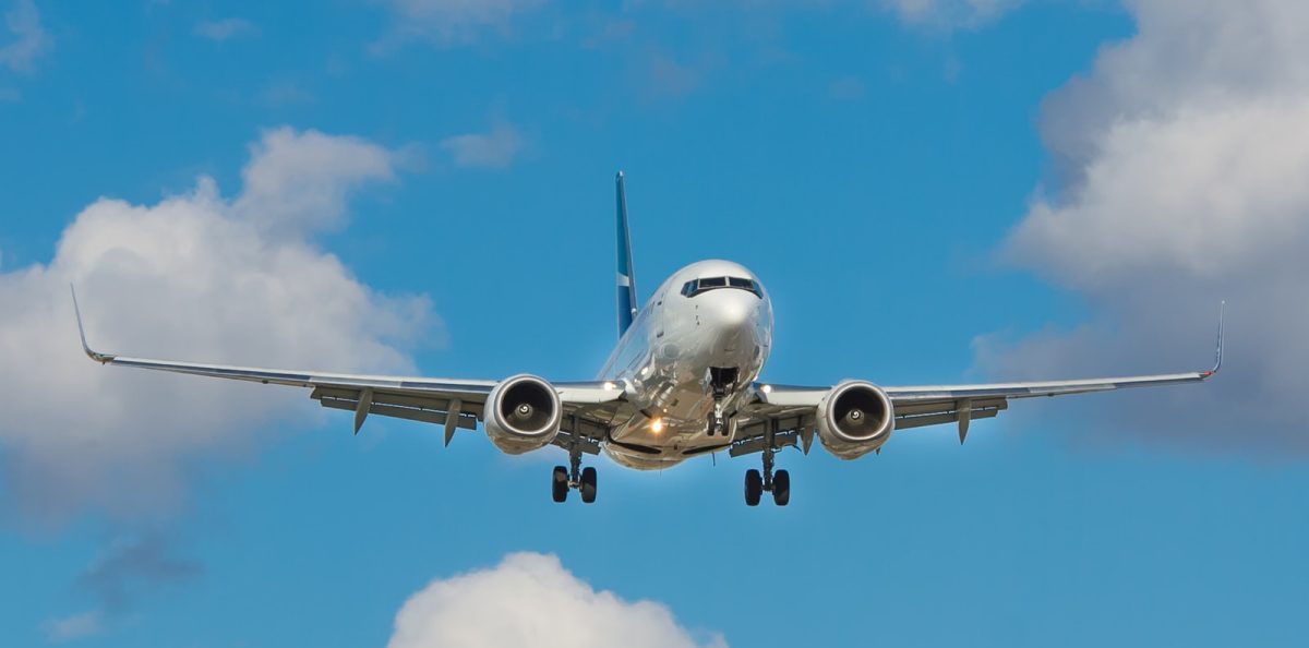white airplane on mid air